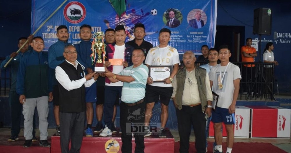 Winners of the 3rd Longleng District Inter-Departmental Tournament 2025, 12th NAP IR Battalion, Chingtok, receiving the overall champion’s trophy during the closing ceremony at the Indoor Badminton Stadium, Longleng, on April 10.